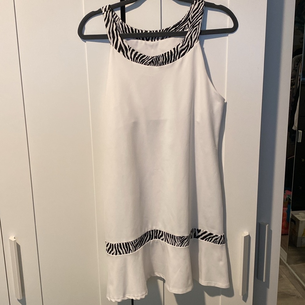 White tennis/athletic dress w/ zebra trim. Worn once! Designed by Peachy Tan.